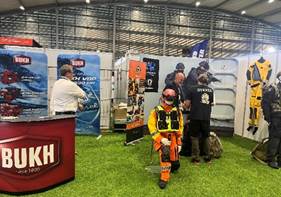 A group of people in a room with signs  AI-generated content may be incorrect.